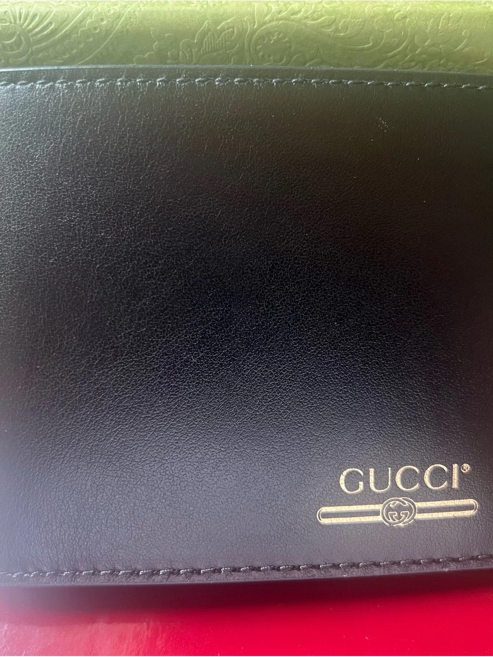 Gucci Black Leather Bifold Wallet with Gold Logo Accent